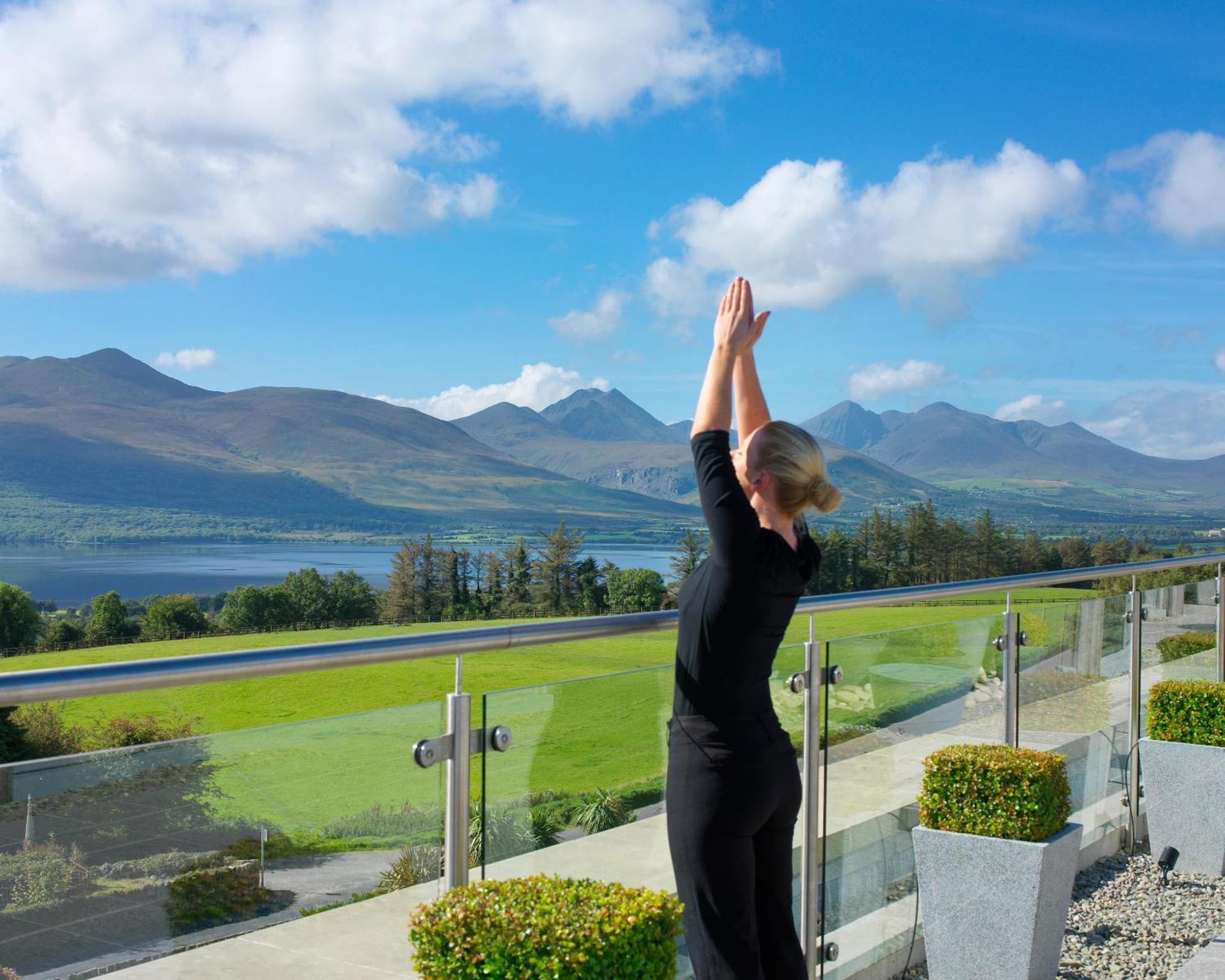 Aghadoe Heights Hotel & Spa Cill Airne Exteriör bild A woman practicing yoga at the Ice House Hotel